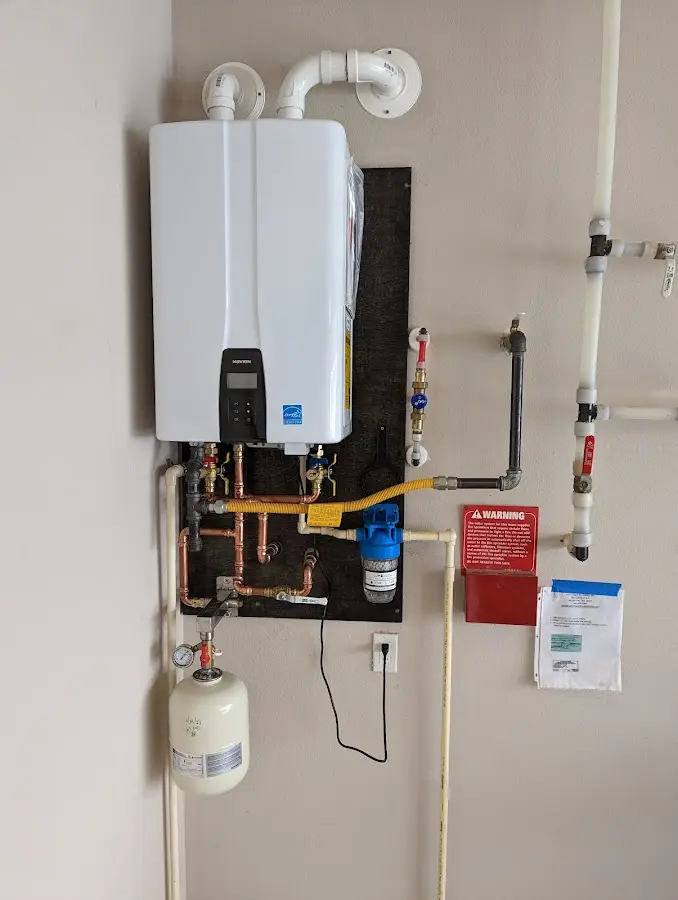 Professional plumber installing copper piping in a Glendale home